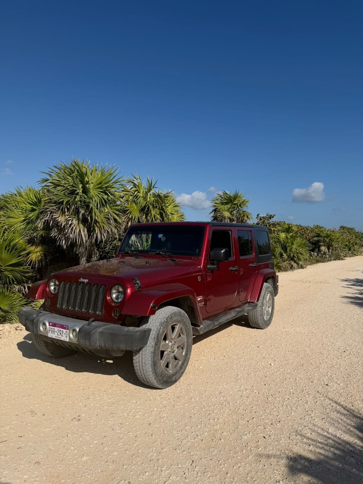 Red Jeep Wrangler Unlimited 4-door rental in Tulum