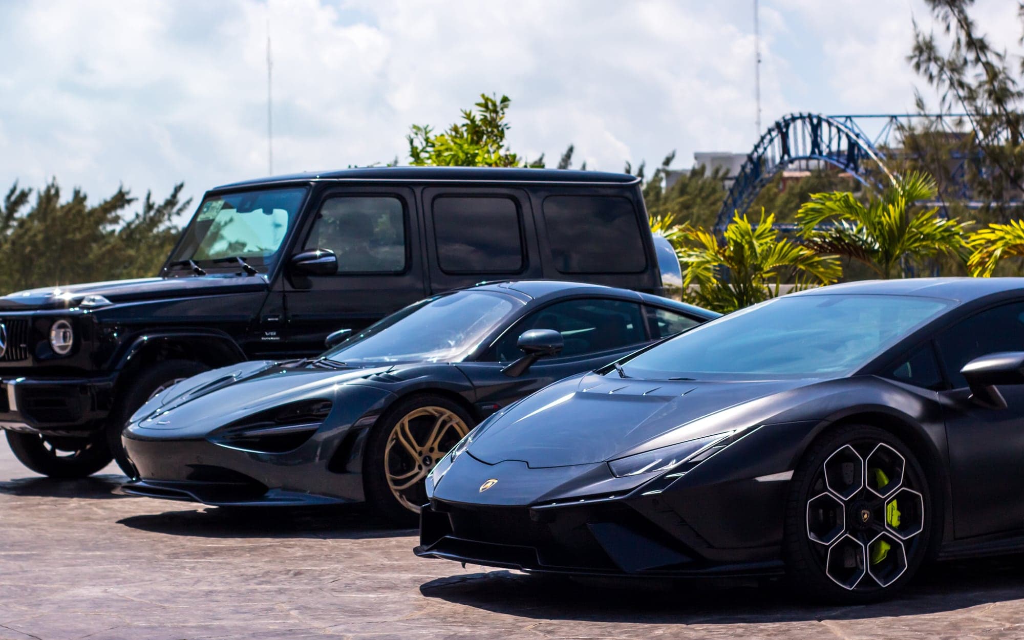 Tulum Roam luxury car lineup with Mercedes, McLaren, Lamborghini and Porsche models